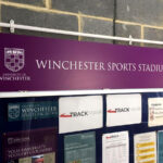 2022 Winchester University Sports Stadium purple and white PVC foamex notice board sign