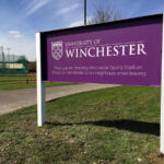 Winchester University Sports Stadium purple and white reverse Panel & Post sign