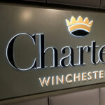 Interior backlit fret-cut Charters sign