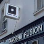 Tanoshi Fusion lightbox illuminated projection sign above fascia